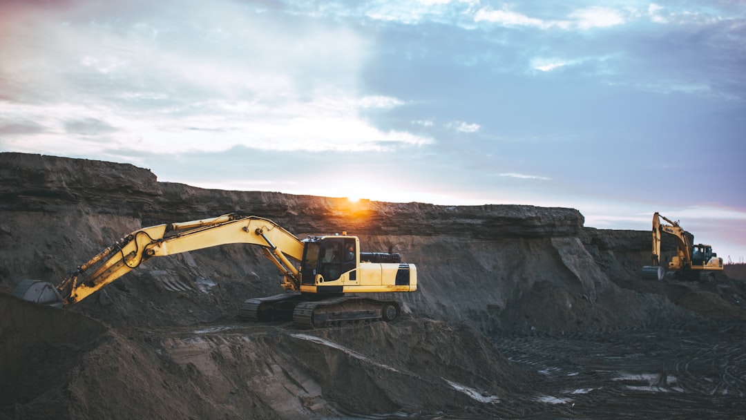 gallery-01 yellow-and-white-excavator-on-rocky-mountain-during-daytime-nwbyxwvn-j0